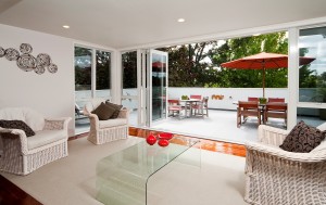 Open plan living opens through bifold doors to northfacing deck